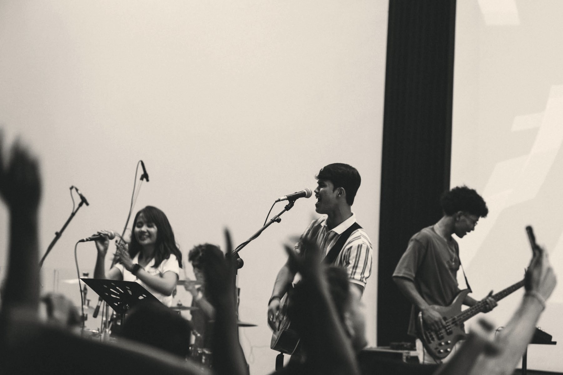 The worship band mid-song, in black and white