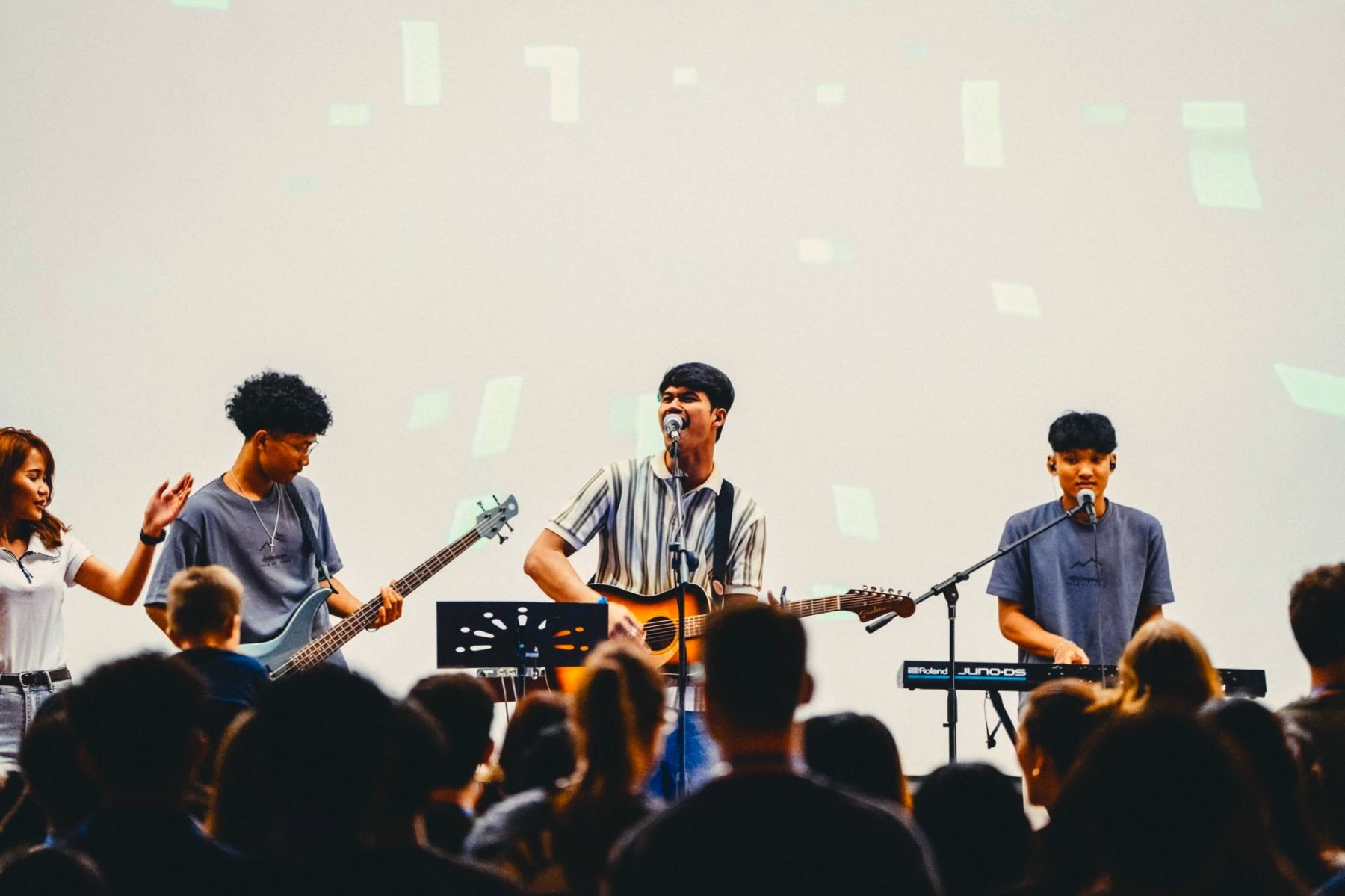A student worship band playing on stage