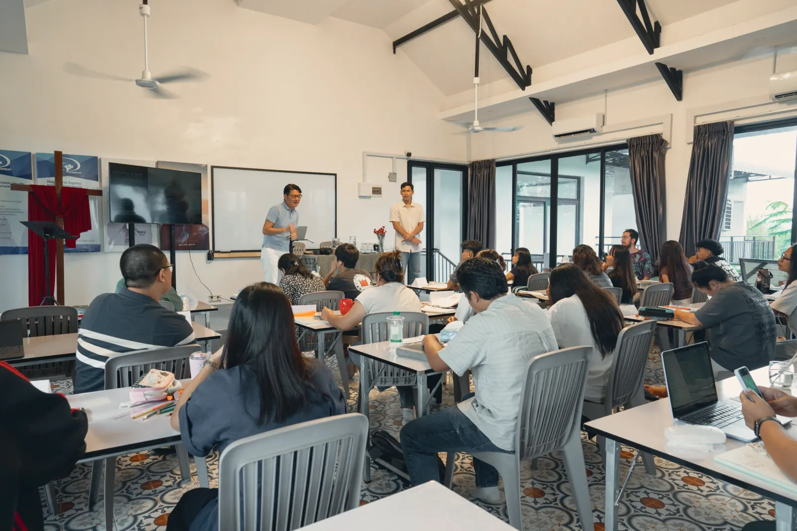 The Bible Counseling School in session, two teachers at the front of the classroom